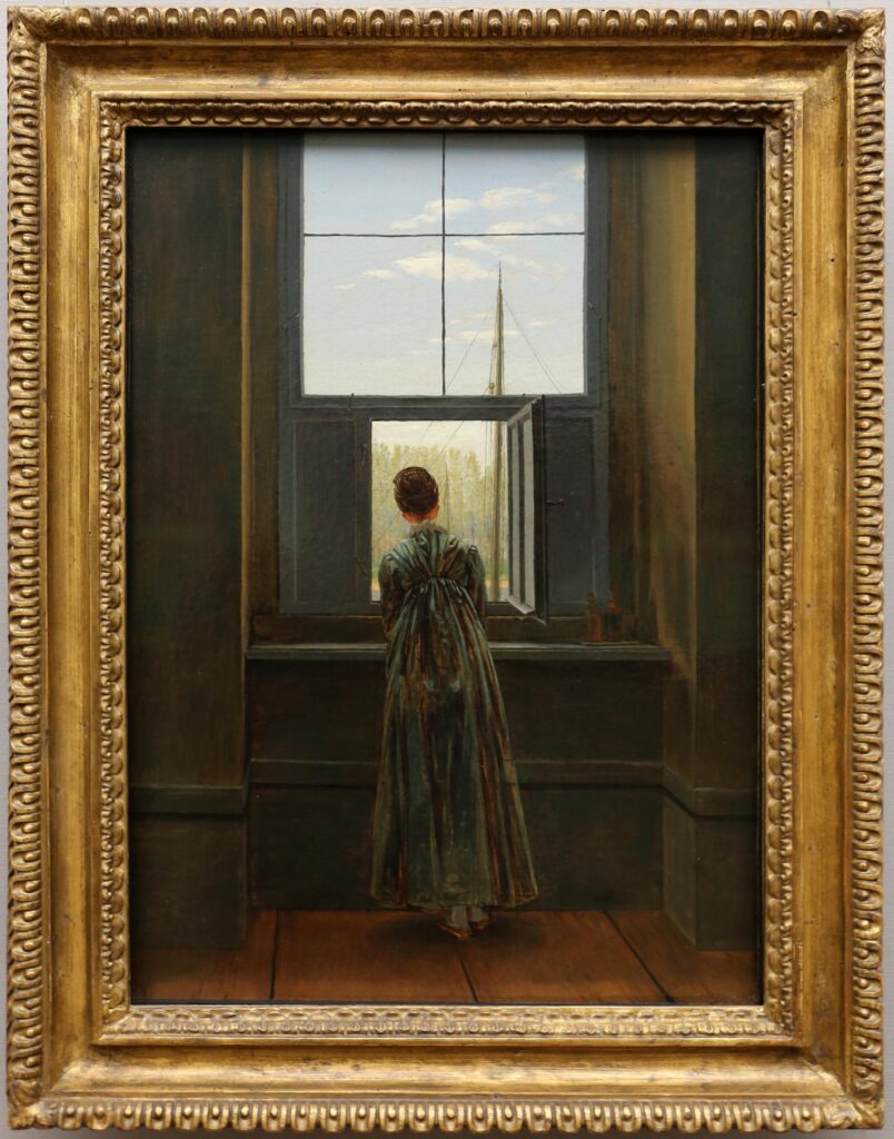 Caspar David Friedrich, donna alla finestra (1822), olio su tela. Conservato presso Alte Nationalgalerie di Berlino, in Germania (credits Commons Wikimedia)